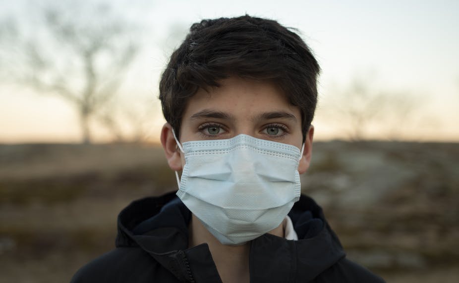 boy wearing mask outside