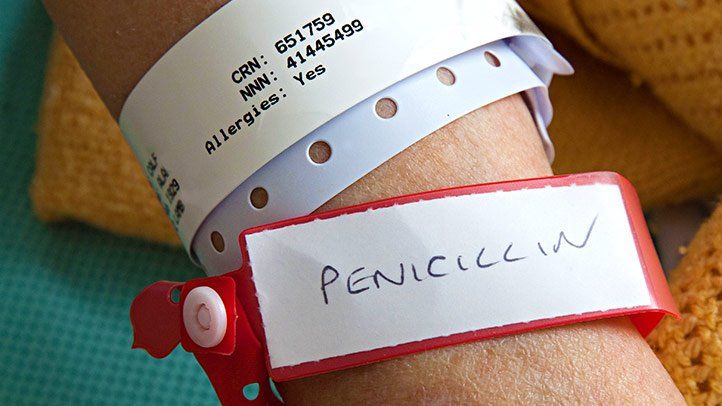 a person wearing a penicillin allergy tag