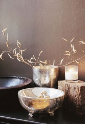 Perhaps you'd like to display a Zen-like vignette. Gather up wood and metal items and pair them with a candle and flowers.