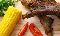 You'd be hard-pressed to find a more traditional Deep South meal than barbecue, corn and tomatoes.